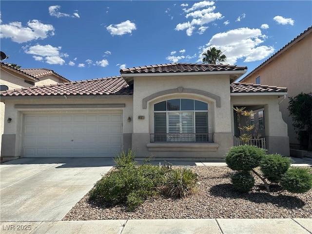 8337 Ruby Heights Ave, Las Vegas, NV 89117 - mediterranean / spanish-style home featuring an attached garage, driveway, stucco siding, and a tile roof