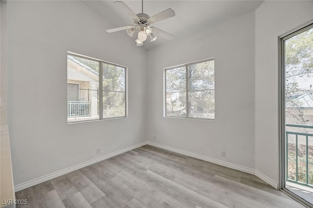 5155 W Tropicana Ave Unit 2095, Las Vegas, NV 89103 - spare room featuring healthy amount of natural light, wood finished floors, and lofted ceiling