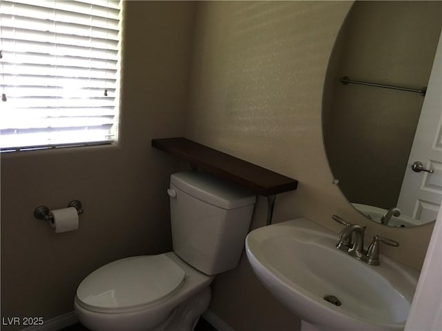 3175 Obscured Light Walk, Henderson, NV 89044 - half bath featuring a sink and toilet