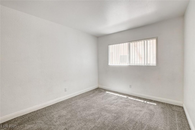 1846 N Decatur Blvd Unit 104, Las Vegas, NV 89108 - carpeted spare room featuring baseboards