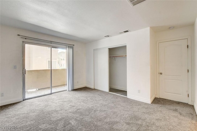 1846 N Decatur Blvd Unit 104, Las Vegas, NV 89108 - unfurnished bedroom featuring carpet flooring, access to exterior, and a closet
