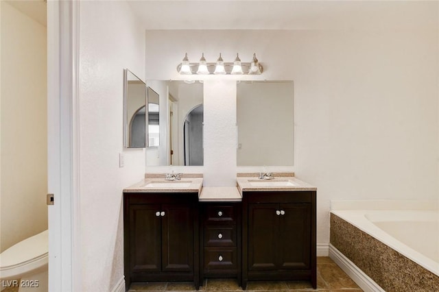 1846 N Decatur Blvd Unit 104, Las Vegas, NV 89108 - full bathroom featuring double vanity, a garden tub, and tile patterned flooring