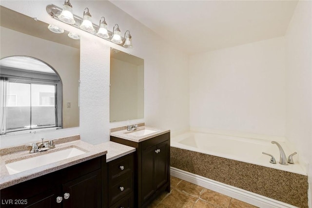 1846 N Decatur Blvd Unit 104, Las Vegas, NV 89108 - full bathroom featuring two vanities, a bath, and tile patterned flooring