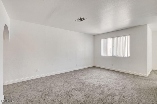 1846 N Decatur Blvd Unit 104, Las Vegas, NV 89108 - unfurnished room featuring carpet and arched walkways