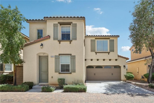 8341 Lower Trailhead Ave, Las Vegas, NV 89113 - mediterranean / spanish-style home featuring a tile roof, stucco siding, a garage, and concrete driveway