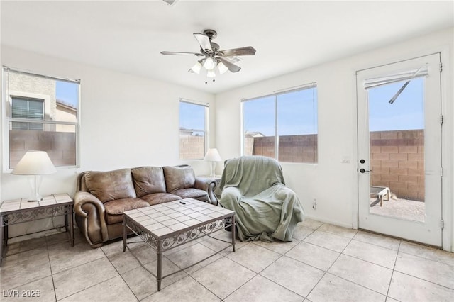 8341 Lower Trailhead Ave, Las Vegas, NV 89113 - living area featuring plenty of natural light, a ceiling fan, and light tile patterned floors