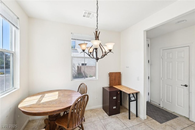 8341 Lower Trailhead Ave, Las Vegas, NV 89113 - dining area featuring a chandelier, baseboards, and light tile patterned floors