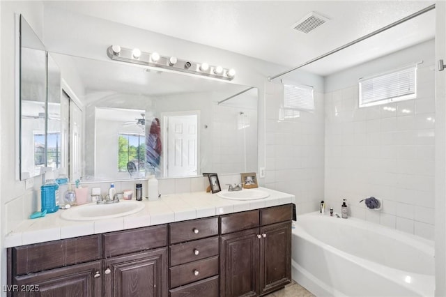 8341 Lower Trailhead Ave, Las Vegas, NV 89113 - bathroom with double vanity, healthy amount of natural light, and shower / bathtub combination