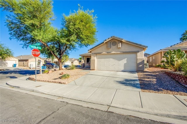 7801 Olympus Ave, Las Vegas, NV 89131 - ranch-style house with stucco siding, driveway, and a garage