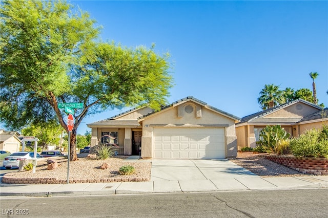 7801 Olympus Ave, Las Vegas, NV 89131 - ranch-style house featuring stucco siding, a garage, and driveway