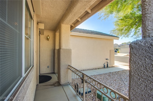 7801 Olympus Ave, Las Vegas, NV 89131 - view of exterior entry featuring stucco siding and a balcony