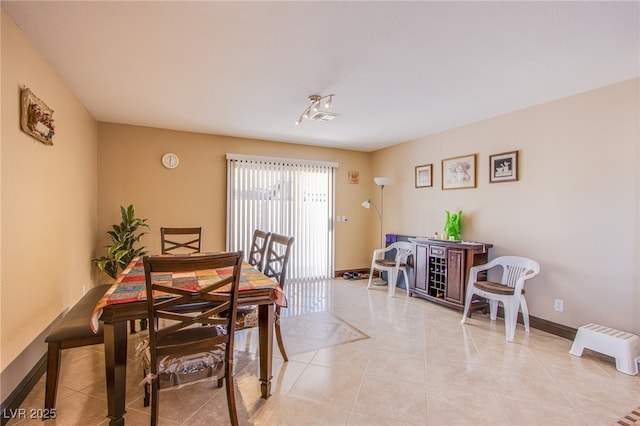 7801 Olympus Ave, Las Vegas, NV 89131 - dining room featuring light tile patterned floors and baseboards