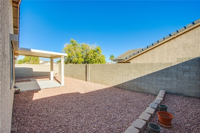 7801 Olympus Ave, Las Vegas, NV 89131 - fenced backyard featuring a patio area