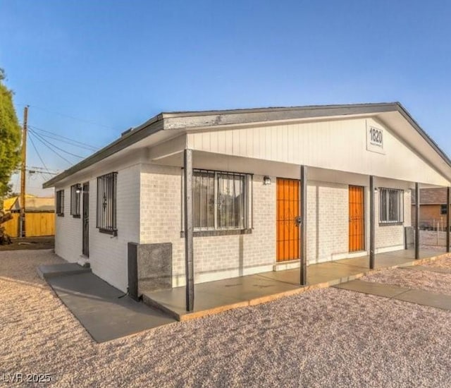 1820 Yale St, North Las Vegas, NV 89030 - view of front of property featuring brick siding and a patio area