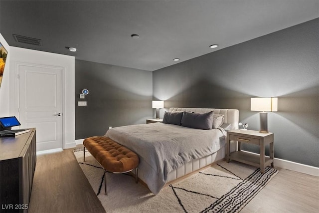 8055 Haywood Estate Ave, Las Vegas, NV 89113 - bedroom featuring light wood-style flooring and recessed lighting
