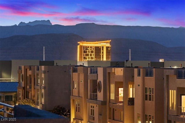 8055 Haywood Estate Ave, Las Vegas, NV 89113 - view of front of house with stucco siding, a mountain view, and a balcony