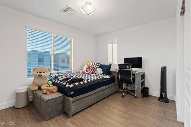 8055 Haywood Estate Ave, Las Vegas, NV 89113 - bedroom with light wood-style floors and baseboards