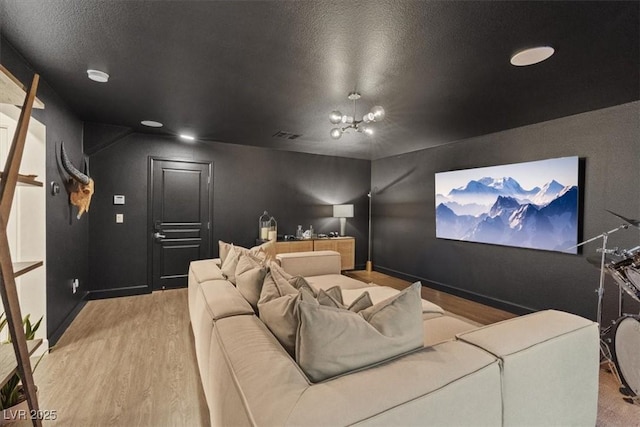 8055 Haywood Estate Ave, Las Vegas, NV 89113 - home theater room featuring wood finished floors and a textured ceiling
