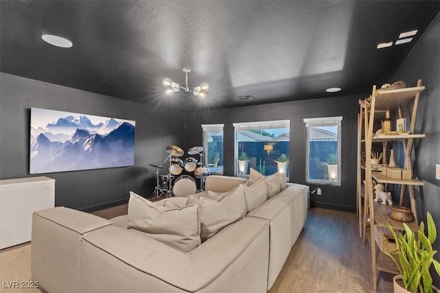 8055 Haywood Estate Ave, Las Vegas, NV 89113 - cinema with a chandelier and wood finished floors