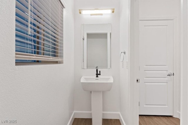 8055 Haywood Estate Ave, Las Vegas, NV 89113 - bathroom with wood finished floors and baseboards