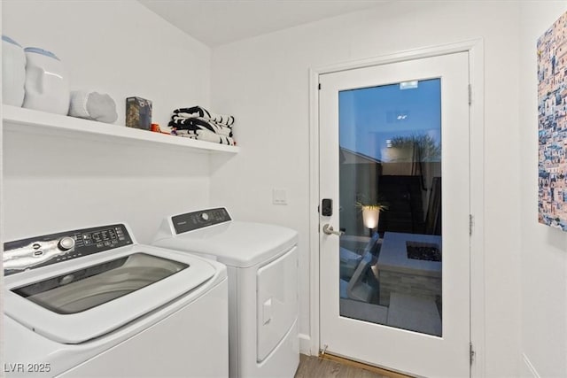 8055 Haywood Estate Ave, Las Vegas, NV 89113 - laundry area with washing machine and dryer and wood finished floors