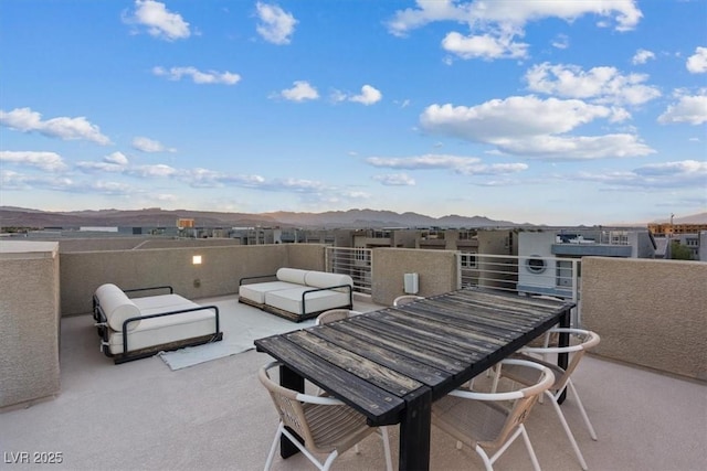 8055 Haywood Estate Ave, Las Vegas, NV 89113 - patio / terrace featuring a mountain view, an outdoor hangout area, and outdoor dining space
