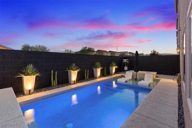 8055 Haywood Estate Ave, Las Vegas, NV 89113 - pool at dusk with a fenced backyard