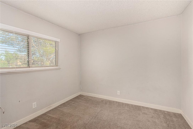 1704 Kismet Cir, Las Vegas, NV 89108 - spare room featuring carpet, baseboards, and a textured ceiling