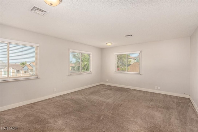 1704 Kismet Cir, Las Vegas, NV 89108 - empty room with carpet flooring, a textured ceiling, and baseboards