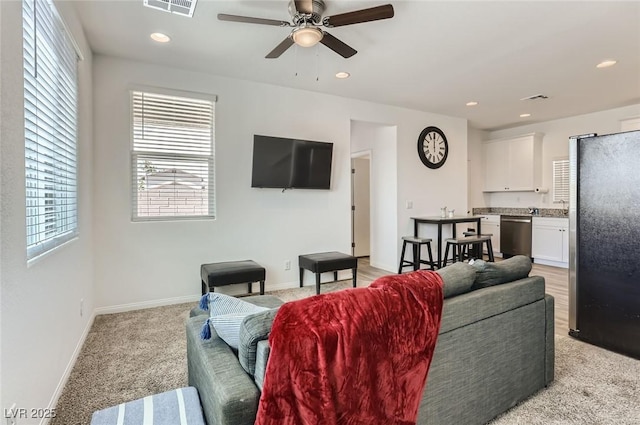 1611 Prairie Fields Ct, Las Vegas, NV 89115 - living room featuring light colored carpet, healthy amount of natural light, ceiling fan, and recessed lighting