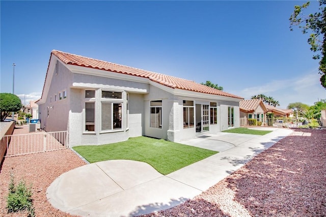 9813 Folsom Dr, Las Vegas, NV 89134 - back of house with stucco siding, a tile roof, and a patio area