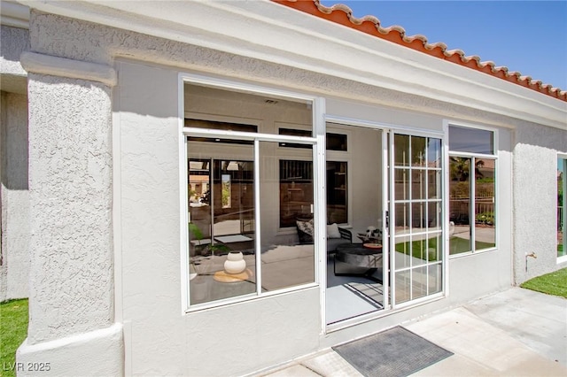 9813 Folsom Dr, Las Vegas, NV 89134 - view of exterior entry featuring stucco siding and a tile roof