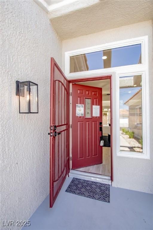 9813 Folsom Dr, Las Vegas, NV 89134 - view of exterior entry with stucco siding and a gate