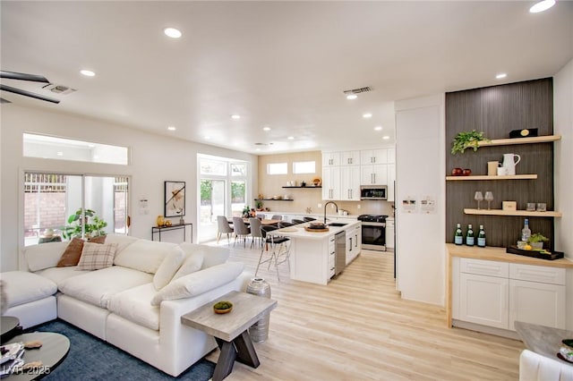 9813 Folsom Dr, Las Vegas, NV 89134 - living room with recessed lighting and light wood-type flooring