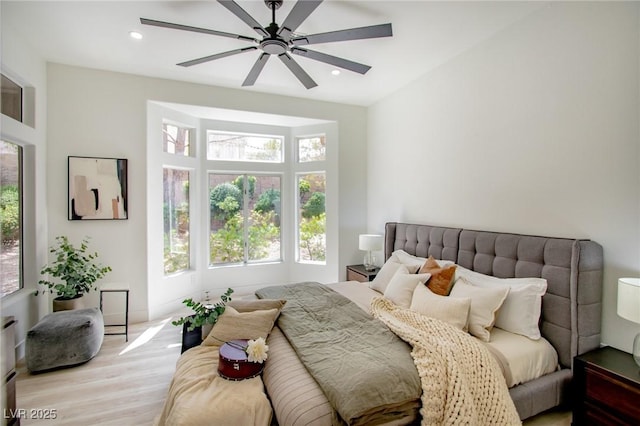 10709 Hunters Woods Pl, Las Vegas, NV 89134 - bedroom with light wood-type flooring, recessed lighting, and ceiling fan