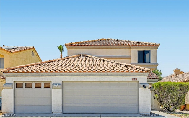 1501 Lucia Dr, Las Vegas, NV 89128 - view of front of house featuring a tiled roof, concrete driveway, and a garage