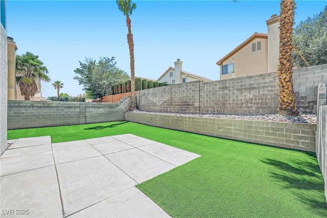1501 Lucia Dr, Las Vegas, NV 89128 - fenced backyard with a patio area