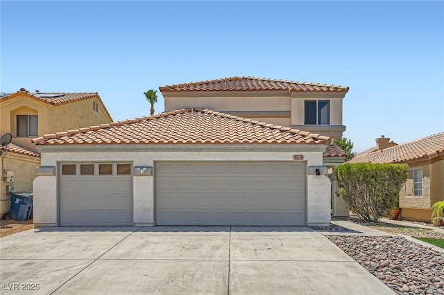 1501 Lucia Dr, Las Vegas, NV 89128 - mediterranean / spanish-style house with concrete driveway, an attached garage, a tile roof, and stucco siding