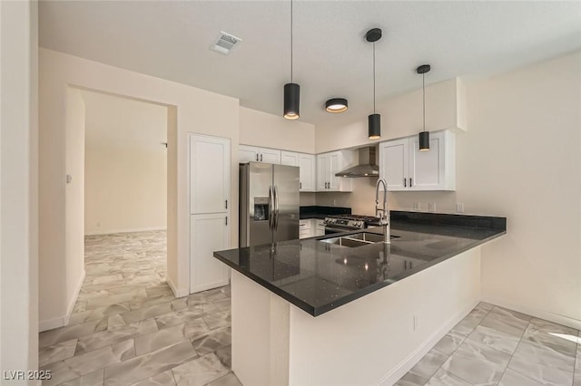 1501 Lucia Dr, Las Vegas, NV 89128 - kitchen featuring stainless steel refrigerator with ice dispenser, wall chimney range hood, light marble finish flooring, a peninsula, and white cabinetry