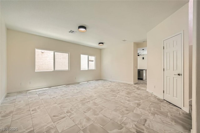 1501 Lucia Dr, Las Vegas, NV 89128 - unfurnished room with light marble finish flooring and baseboards