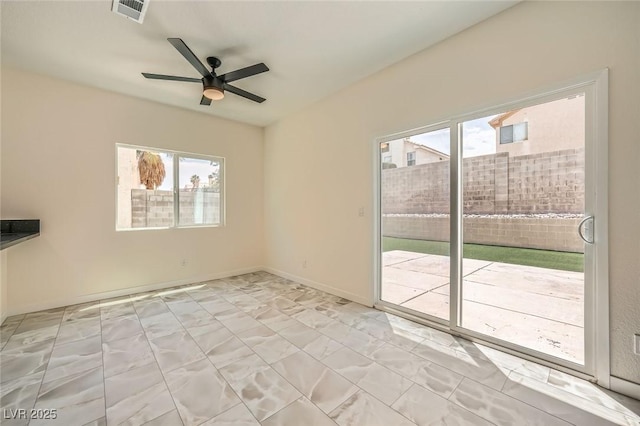 1501 Lucia Dr, Las Vegas, NV 89128 - spare room with plenty of natural light, ceiling fan, and light marble finish flooring