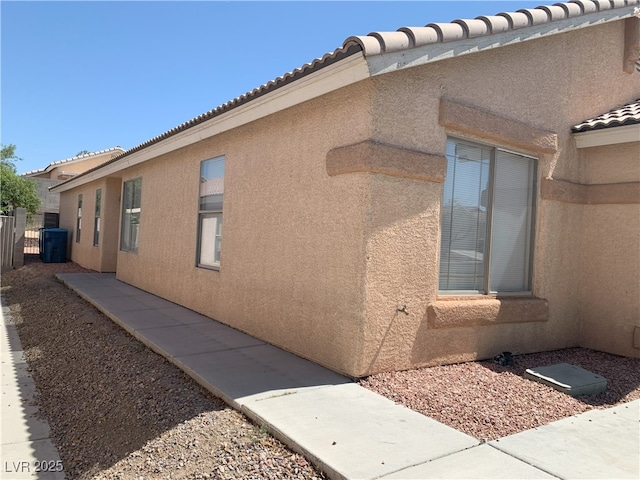 6470 Shining Sand Ave, Las Vegas, NV 89142 - view of property exterior with stucco siding and a tile roof