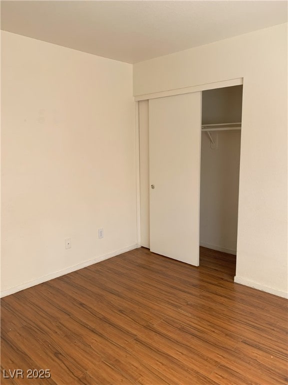 6470 Shining Sand Ave, Las Vegas, NV 89142 - unfurnished bedroom featuring wood finished floors and a closet