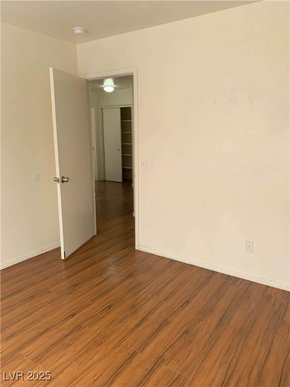 6470 Shining Sand Ave, Las Vegas, NV 89142 - spare room featuring light wood-style floors and a smoke detector