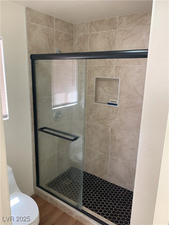 6470 Shining Sand Ave, Las Vegas, NV 89142 - full bathroom with a stall shower and wood finished floors