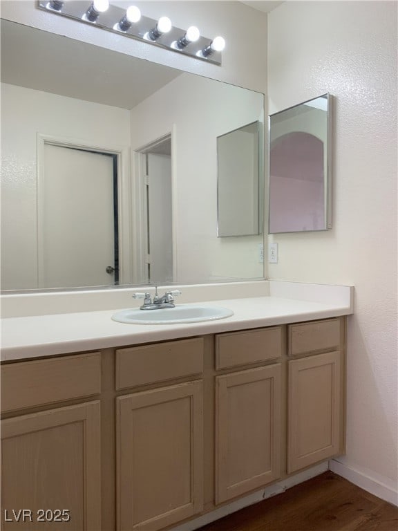 6470 Shining Sand Ave, Las Vegas, NV 89142 - bathroom with vanity and wood finished floors