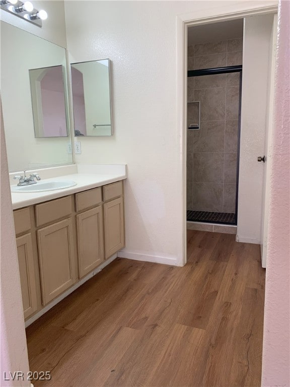6470 Shining Sand Ave, Las Vegas, NV 89142 - full bath with vanity, a shower stall, and wood finished floors