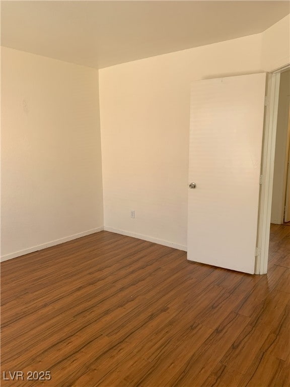 6470 Shining Sand Ave, Las Vegas, NV 89142 - unfurnished room featuring wood finished floors and baseboards