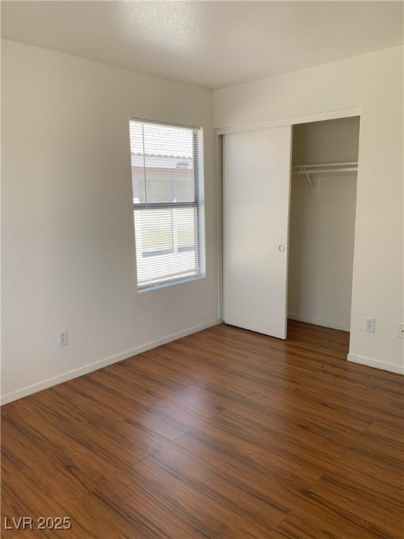 6470 Shining Sand Ave, Las Vegas, NV 89142 - unfurnished bedroom featuring wood finished floors and a closet