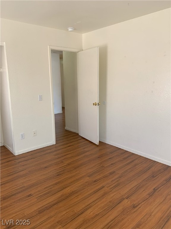 6470 Shining Sand Ave, Las Vegas, NV 89142 - empty room featuring wood finished floors and a smoke detector